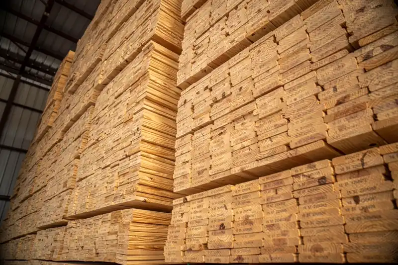 Stacked timber inside a warehouse