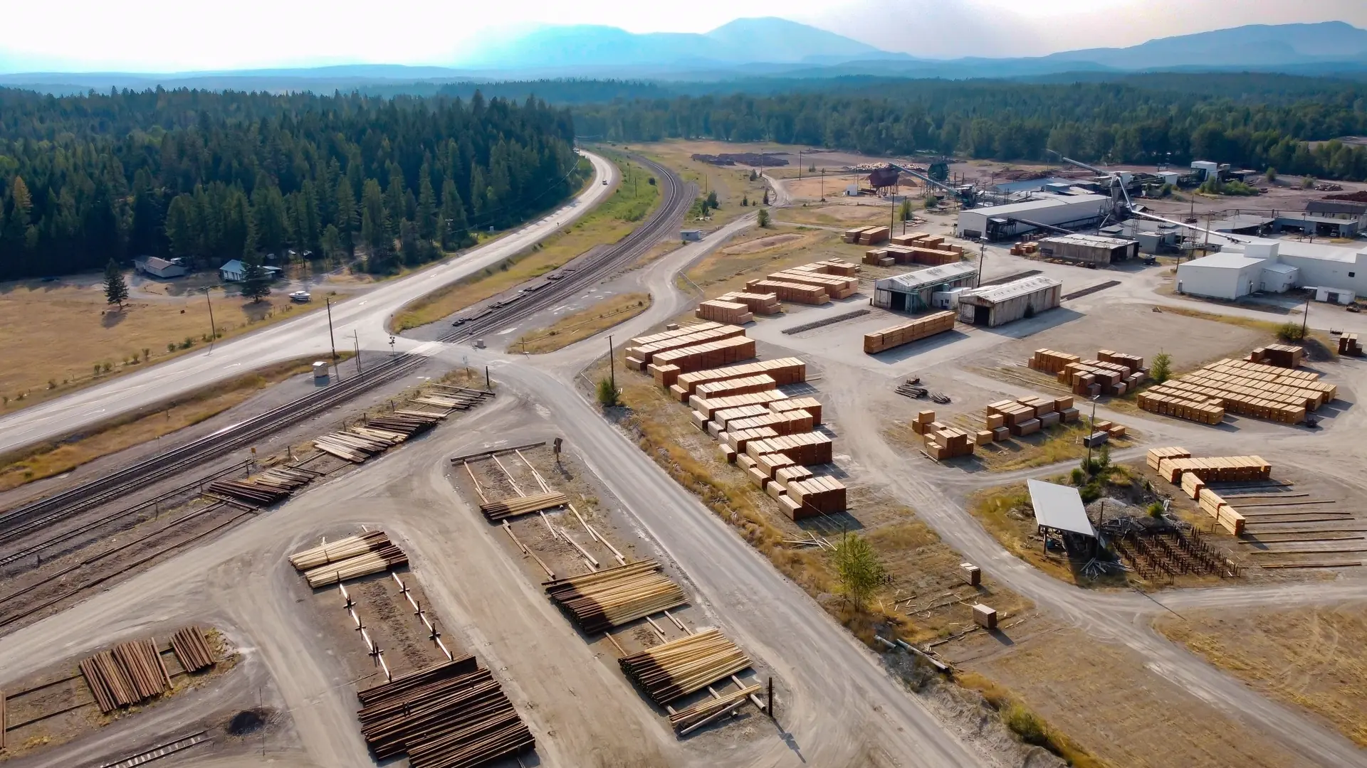 Aerial view of a large lumber yard and sawmill operation