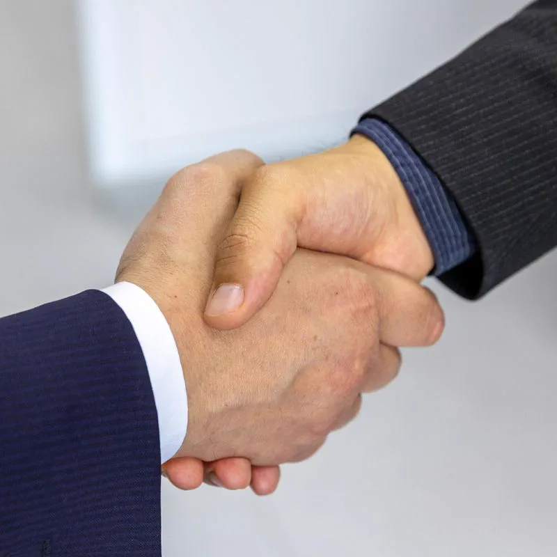 Business handshake representing customer partnership