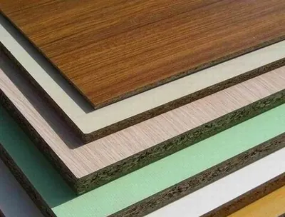 Stack of decorative laminated panels in woodgrain and solid colours — photo 15 of 15