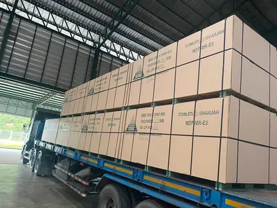 Dowlet MDF bundles loaded on a flatbed trailer inside a warehouse — photo 2 of 15
