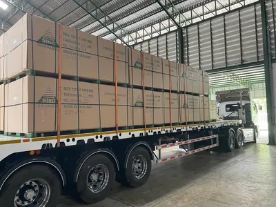 Strapped MDF bundles loaded on a trailer for export — photo 3 of 15
