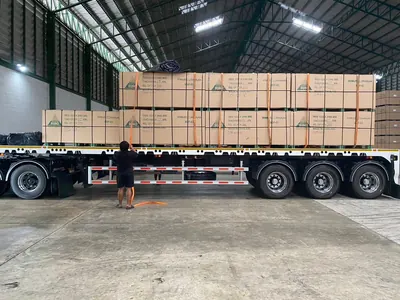 Trailer loaded with packed MDF bundles in a warehouse — photo 4 of 15